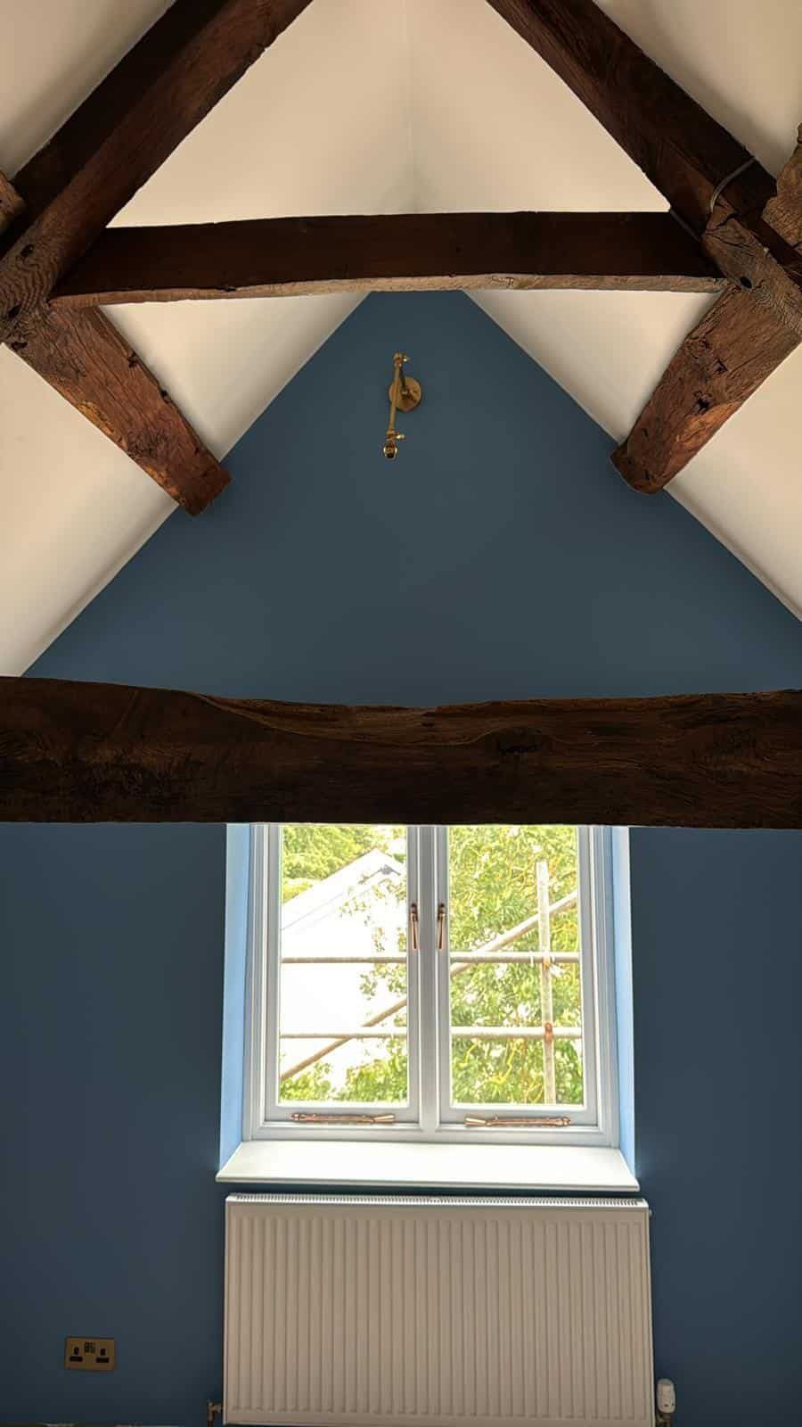 Blue gable wall and oak truss