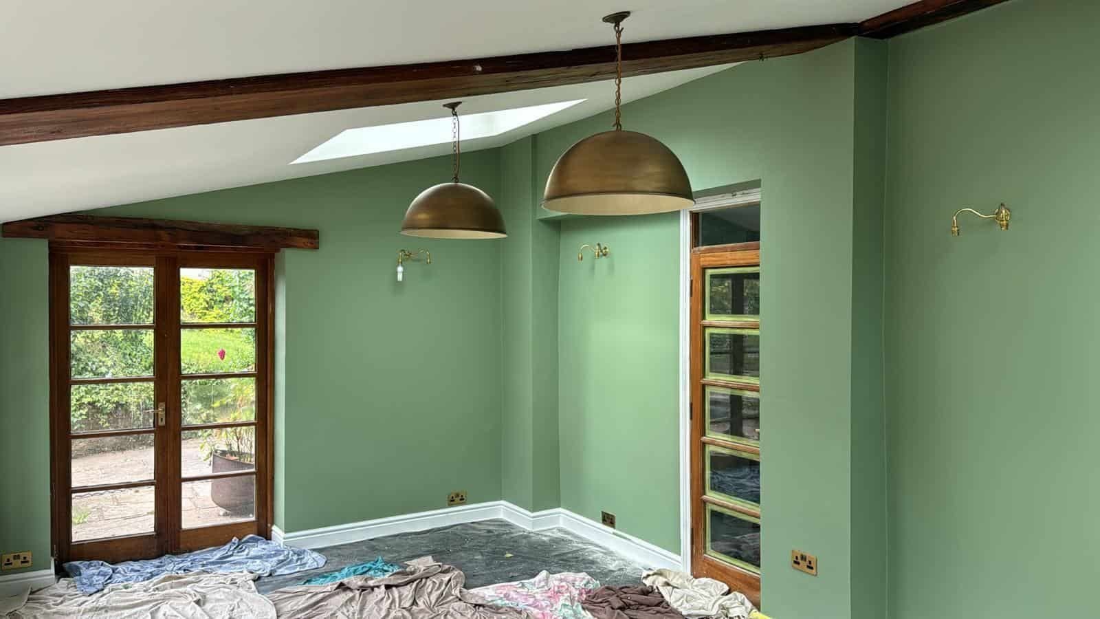 Sage green room with open doorway