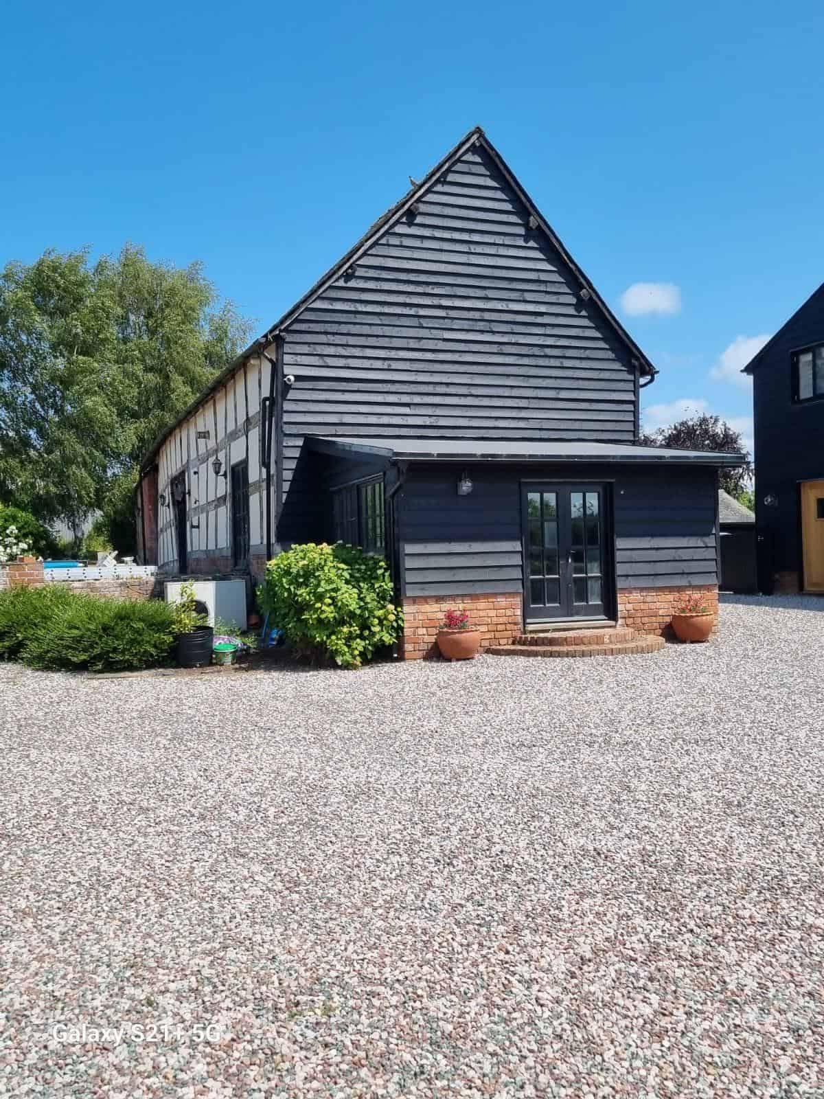 Barn gable and front garden after decorating
