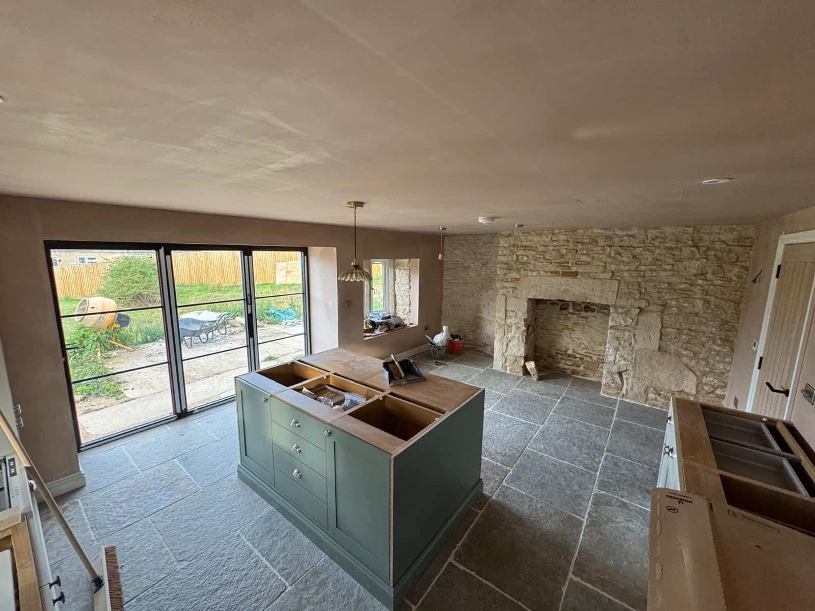 Kitchen island and fireplace wall in progress