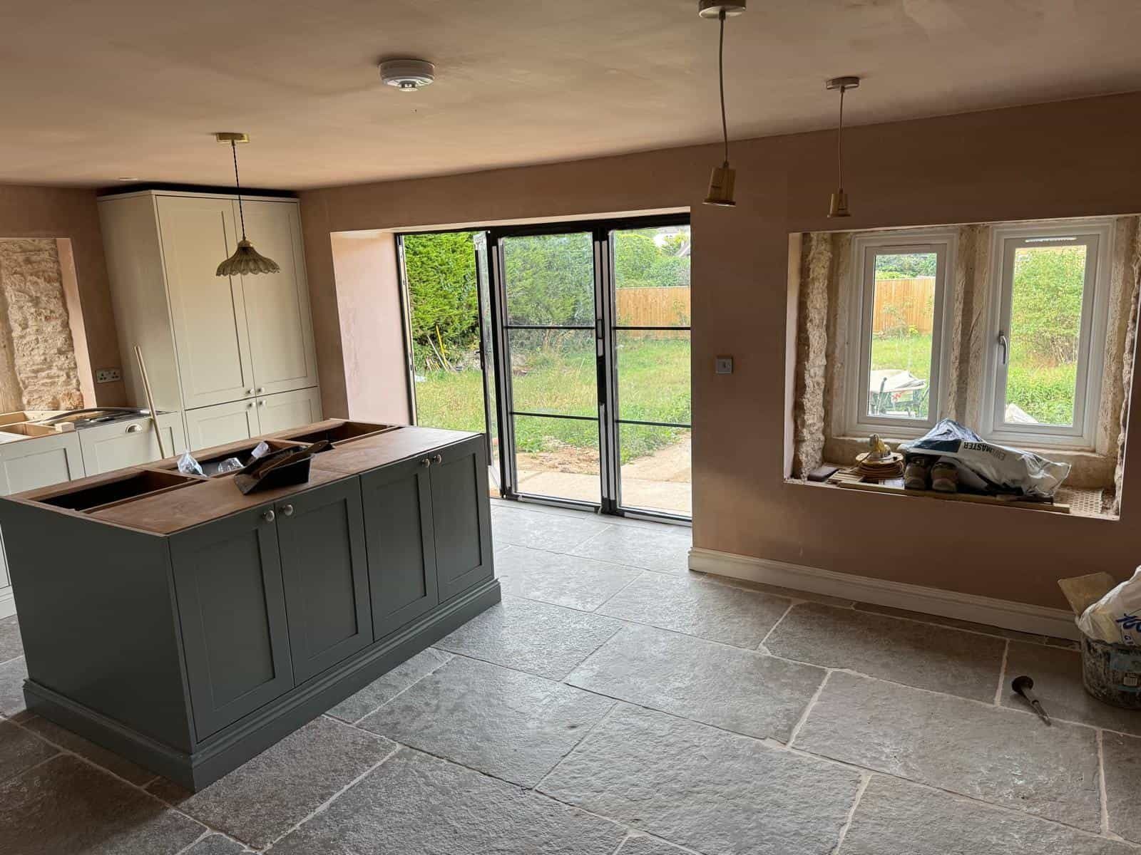 Kitchen with flagstone floor and glazed doors