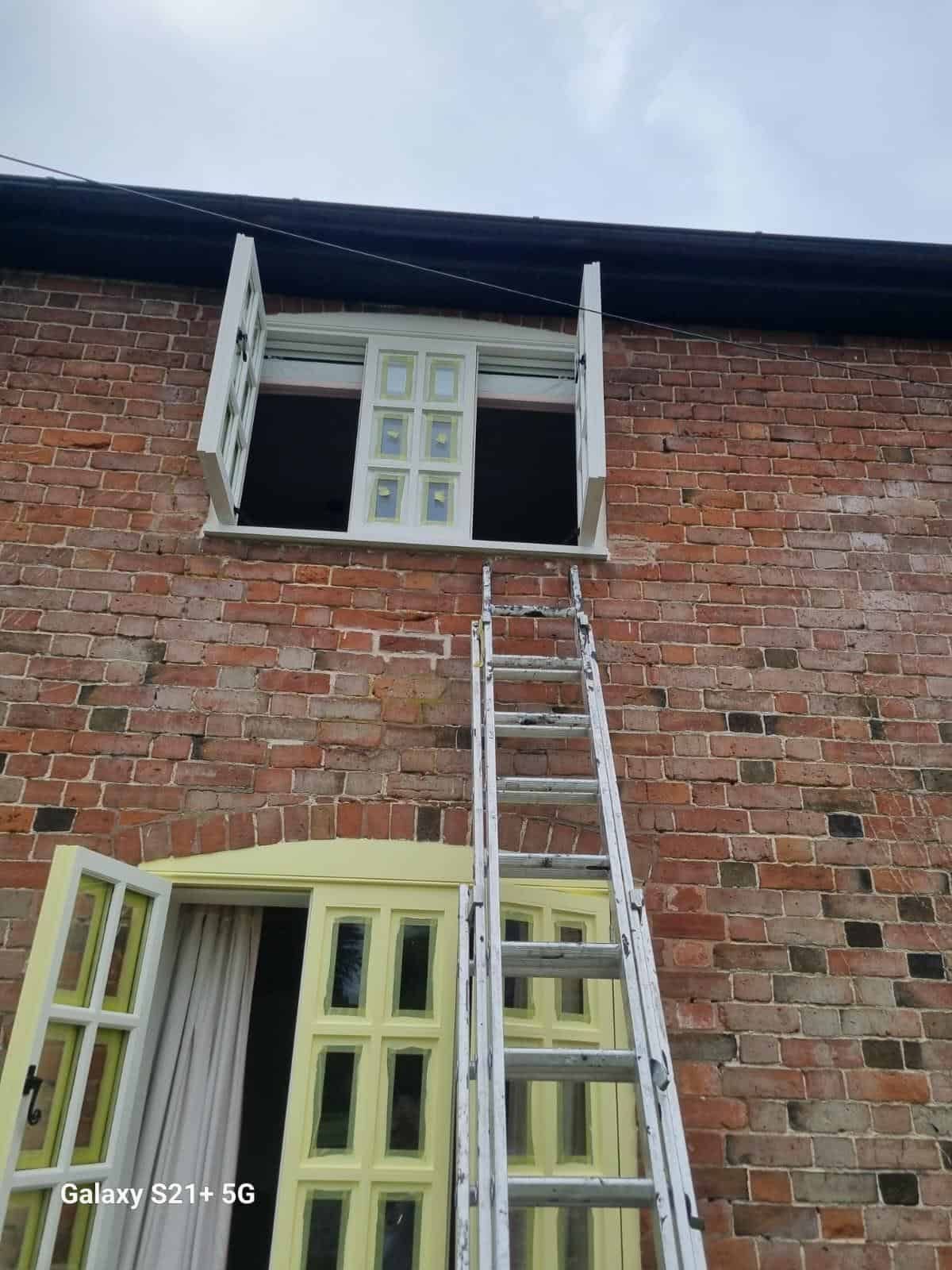 Ladders set up for window painting