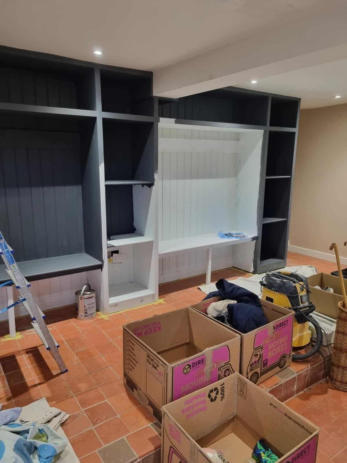 Dark painted boot room storage during fitting