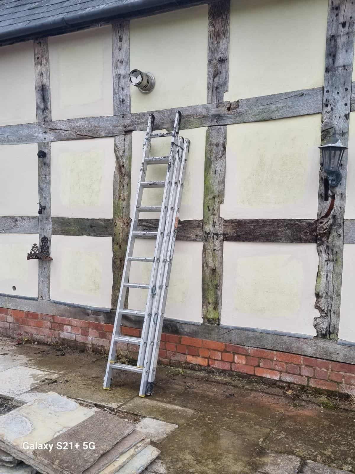 Infill panels during preparation with ladder in place
