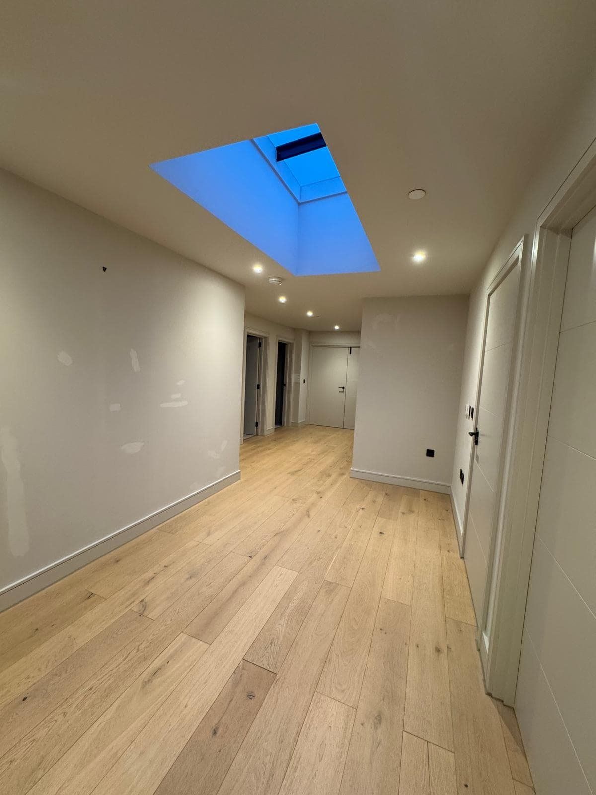 Hallway with roof light and oak floor