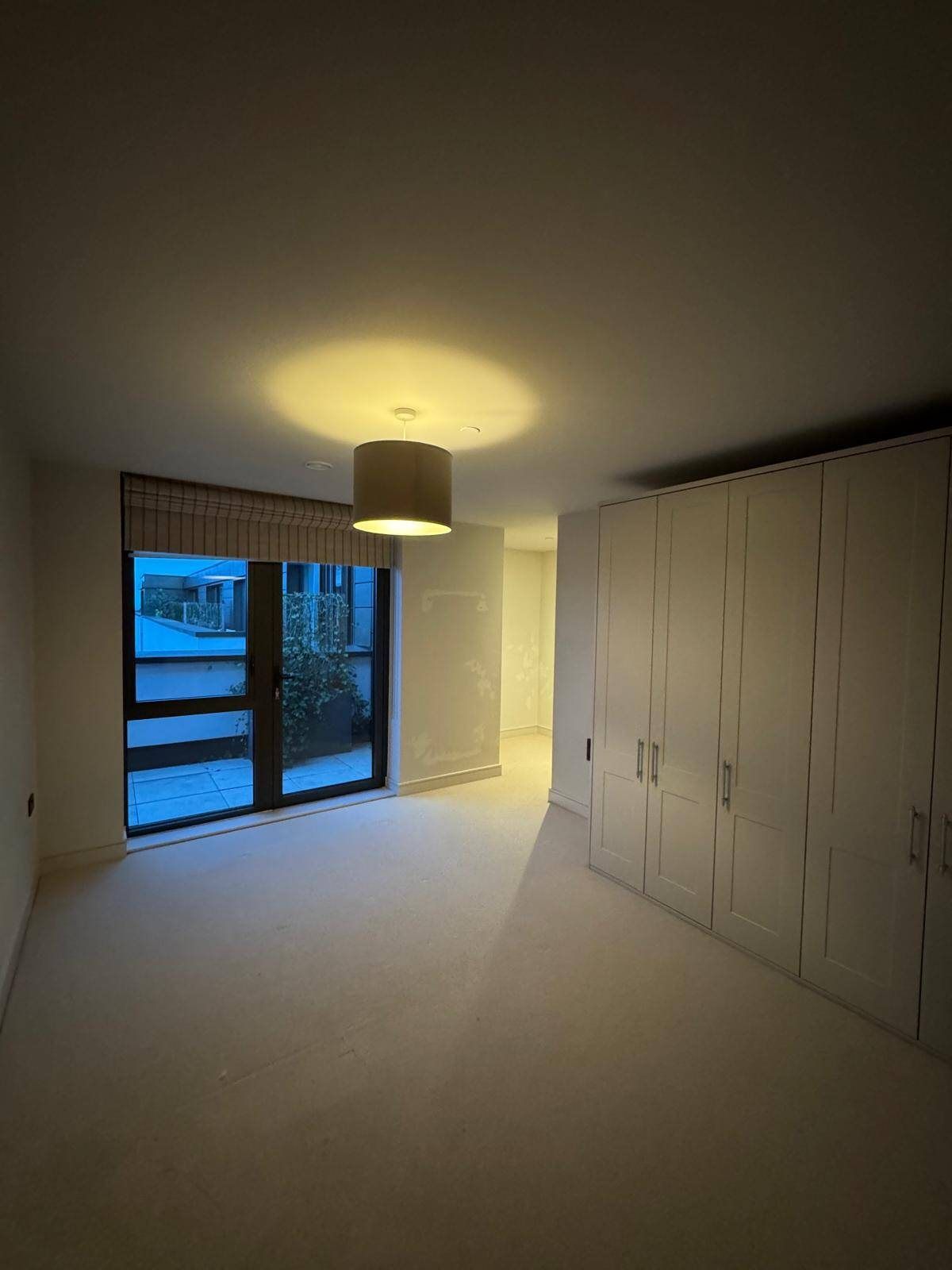 Bedroom with built-in wardrobes after decorating