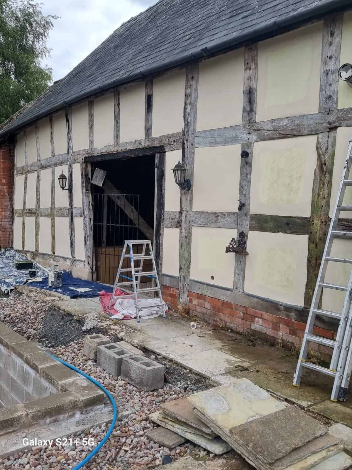 Work in progress along the barn elevation
