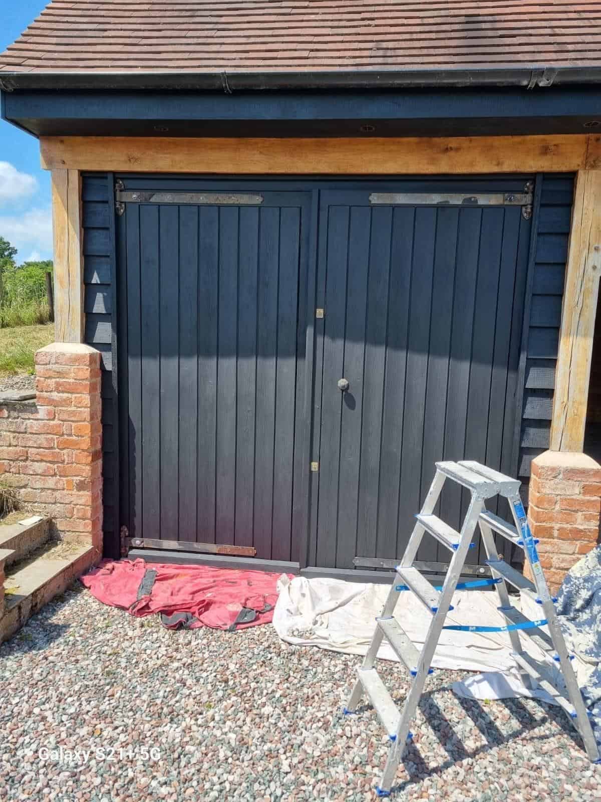 Painted black garage doors